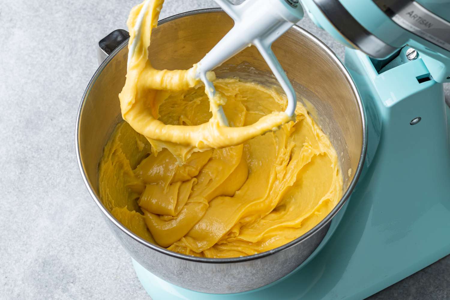 Glossy choux dough in a stand mixer