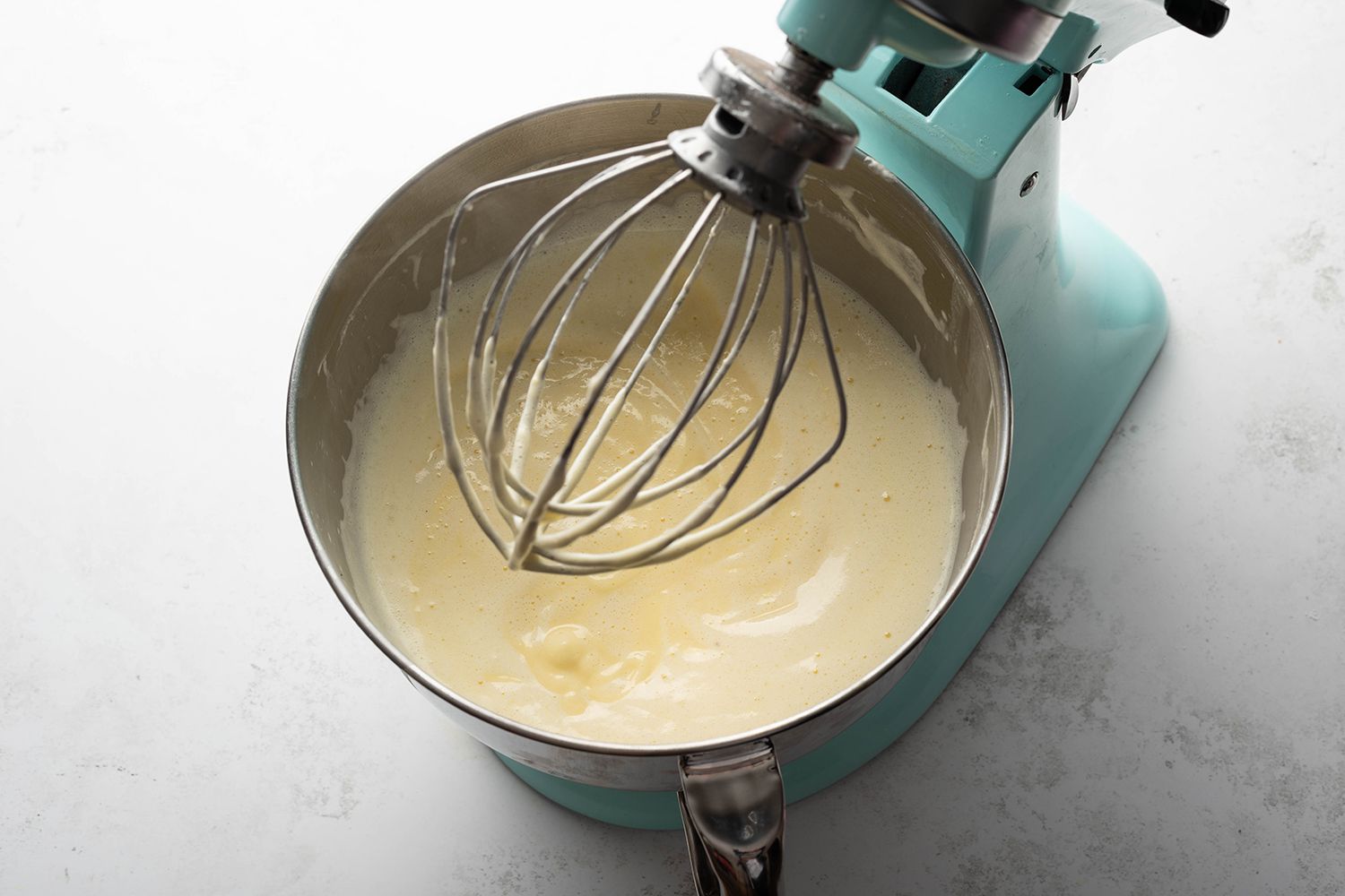 Whipped cream and pudding mixtures in a stand mixer 