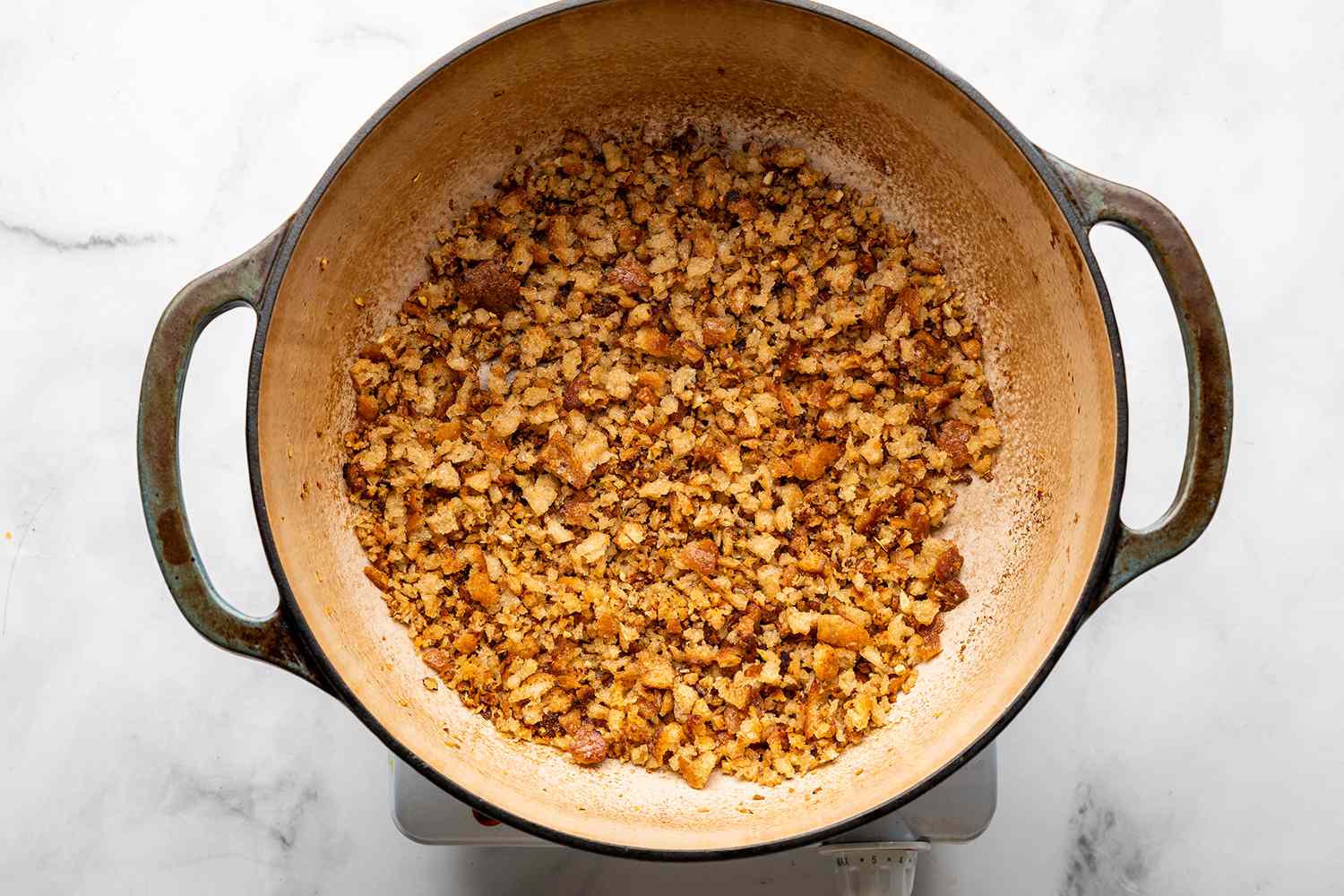 Breadcrumbs in a pot on a burner 