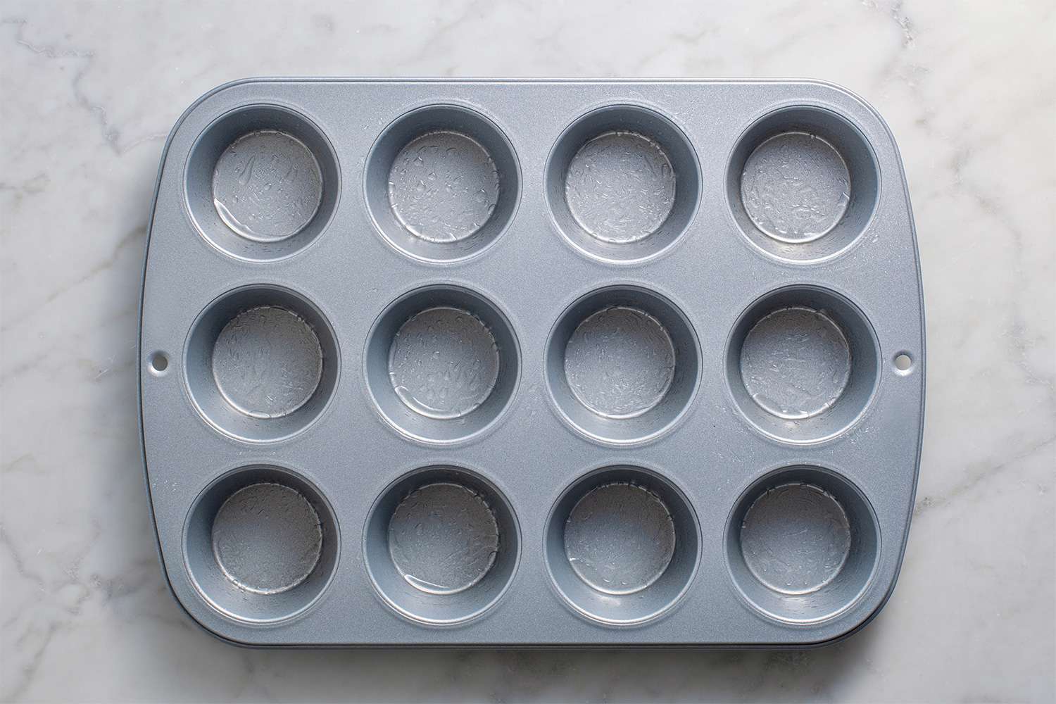 Muffin tin greased with nonstick spray