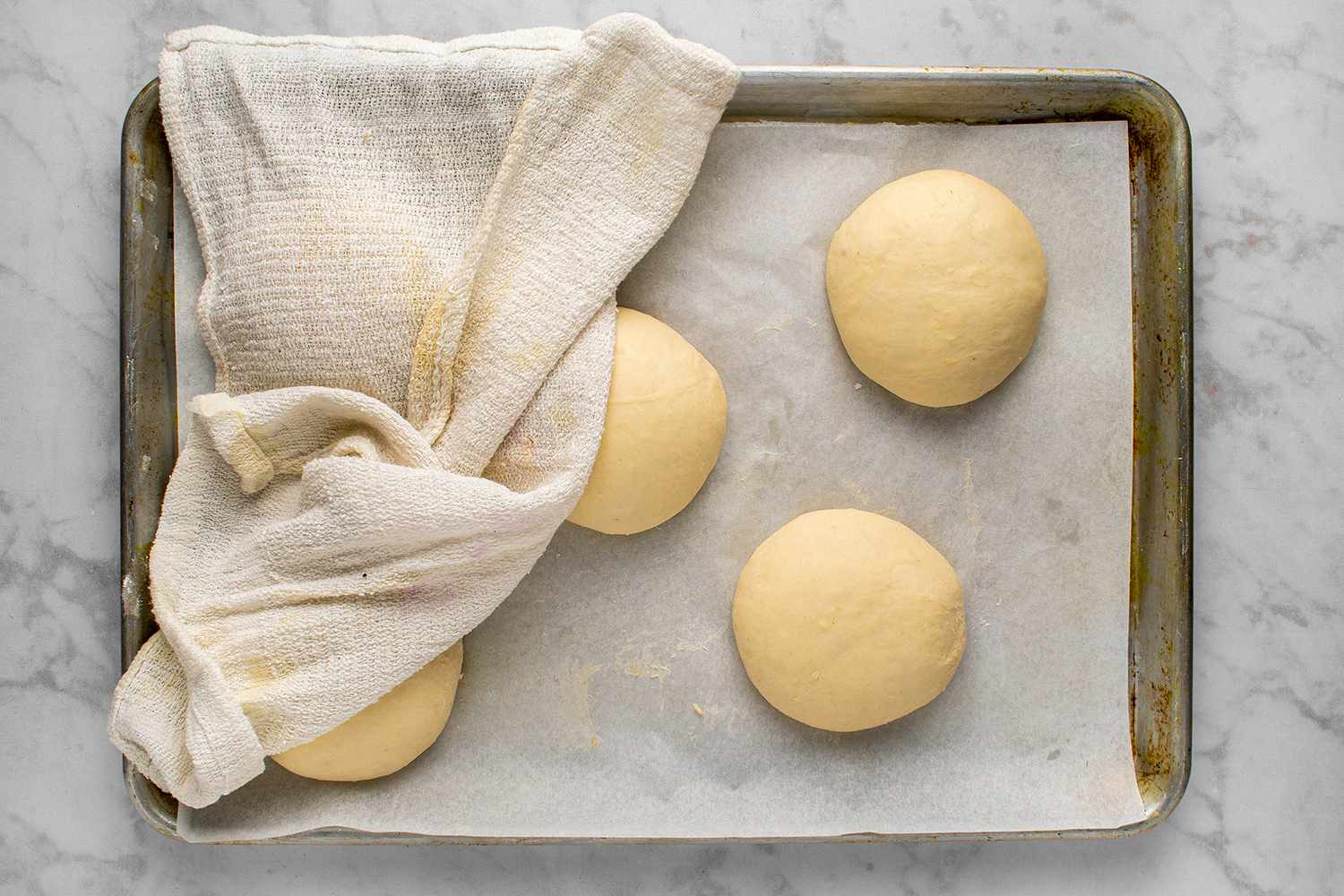Potato dough balls covered with damp towel