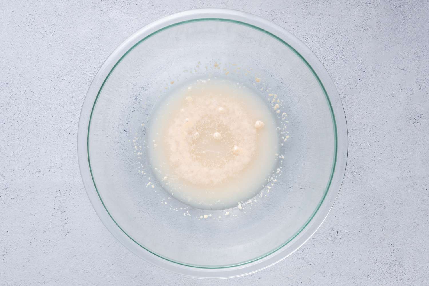 Water, sugar, and yeast in a large bowl