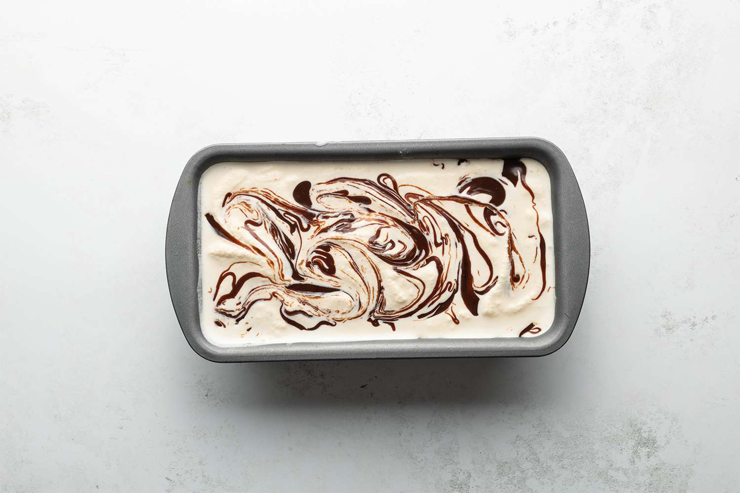 Ice cream with chocolate syrup in a container 