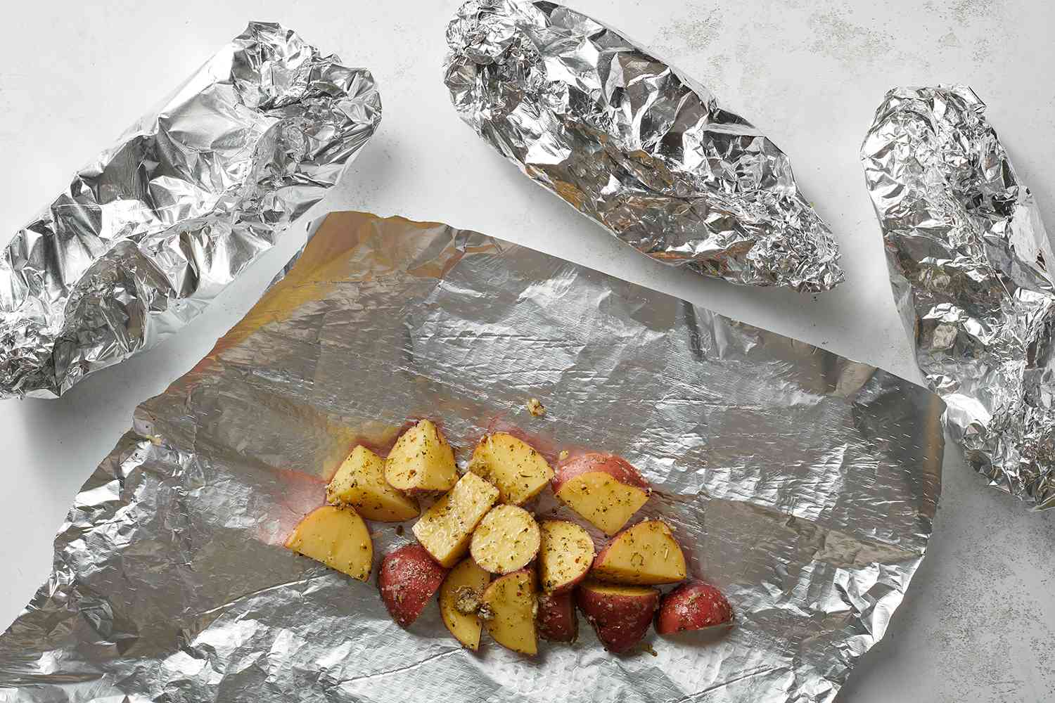 seasoned potatoes wrapped in foil