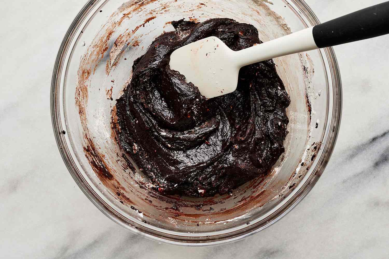 flour folded in to brownie batter with spatula