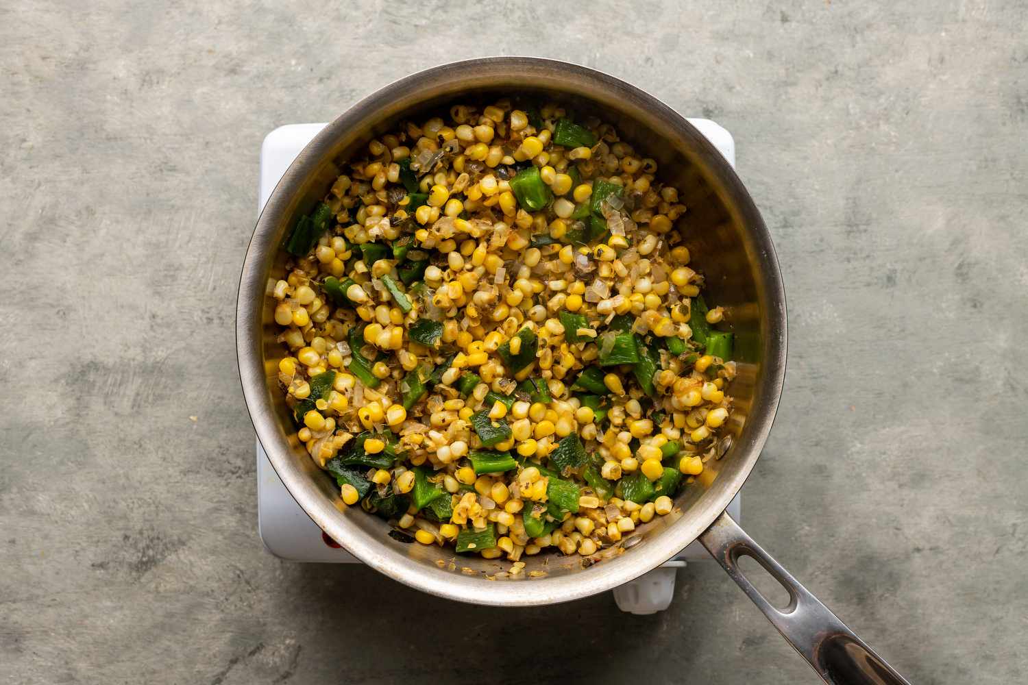 Roasted Chili Corn Salsa in a pot on the burner 