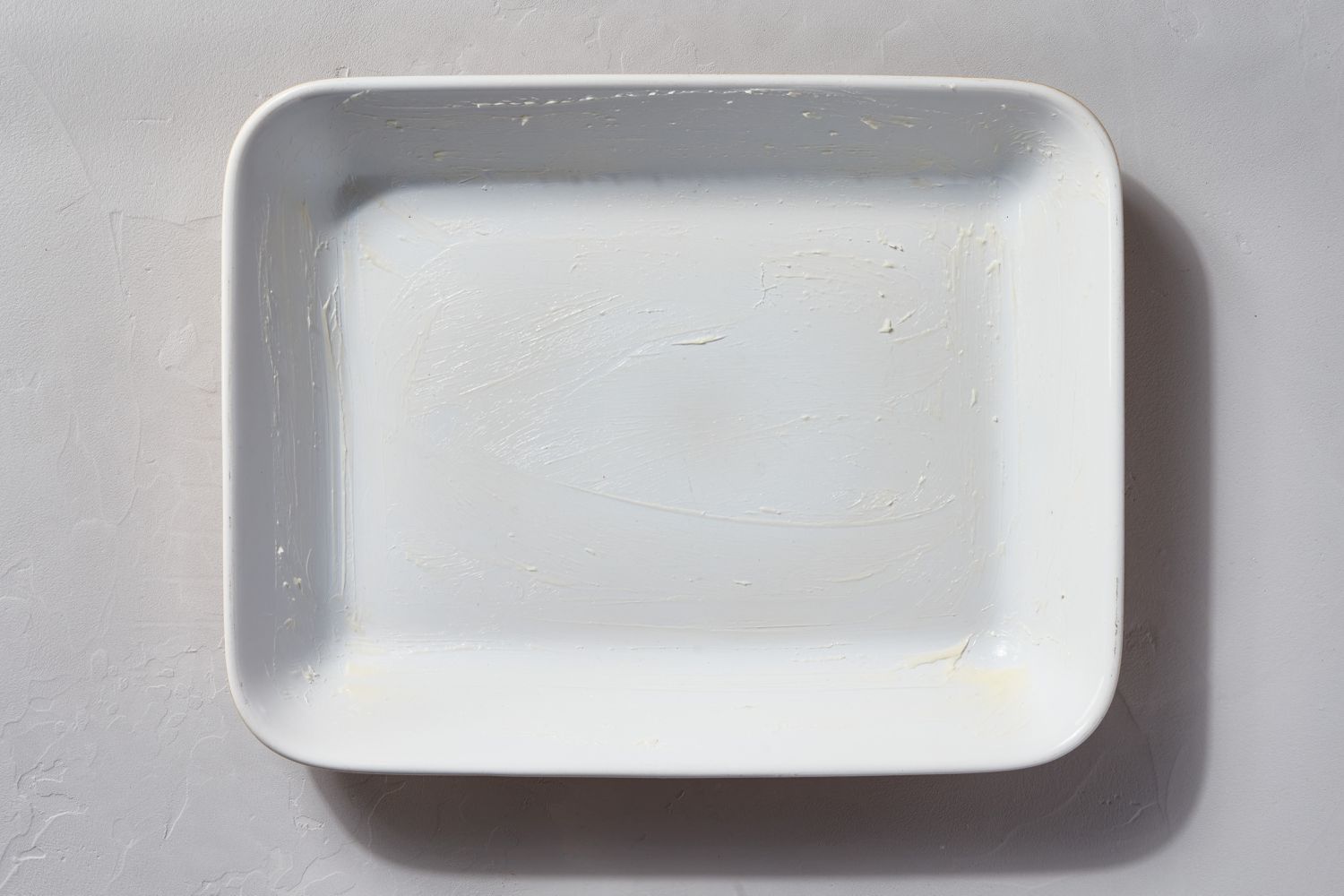 A buttered baking dish