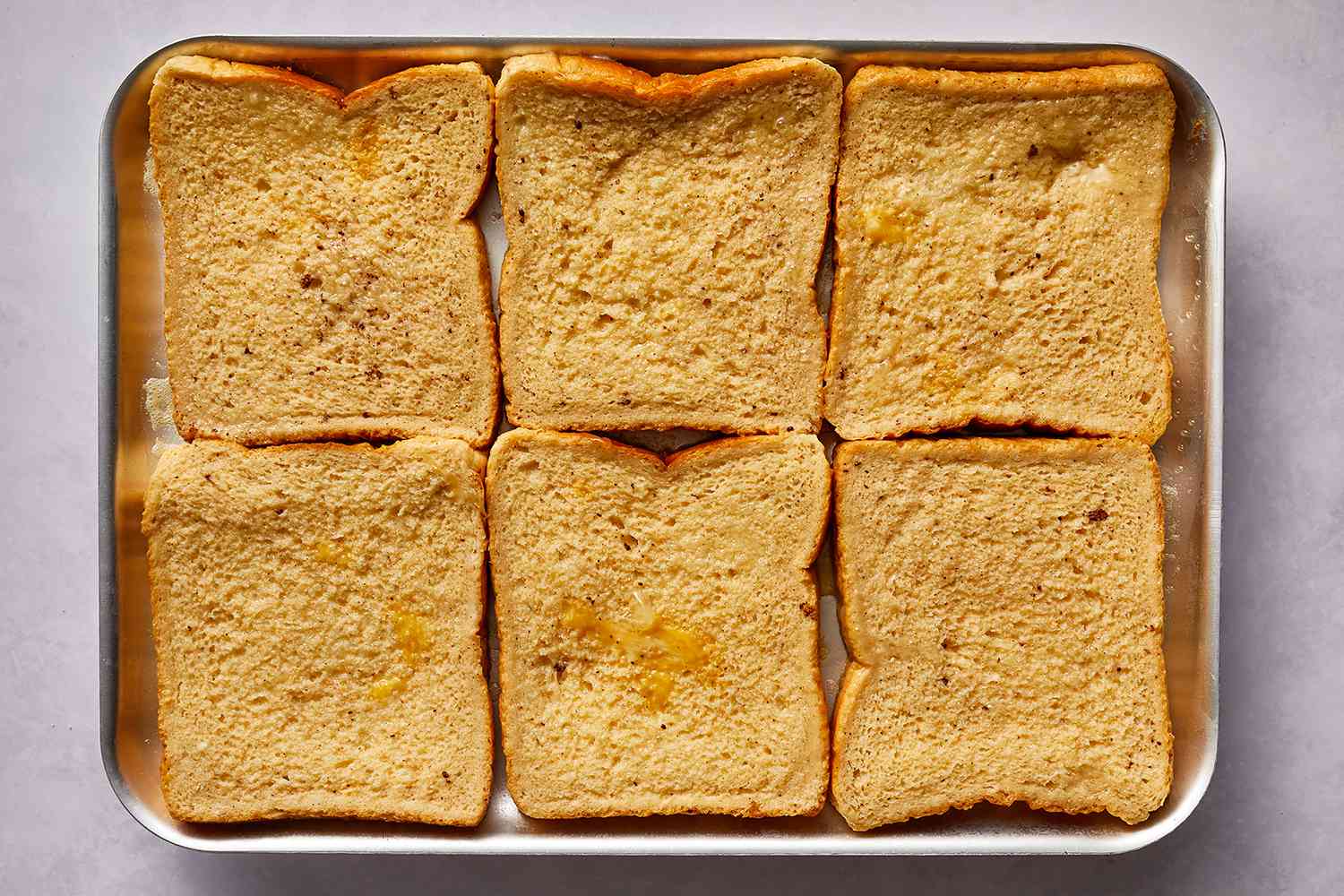 Bread slices on a sheet pan 
