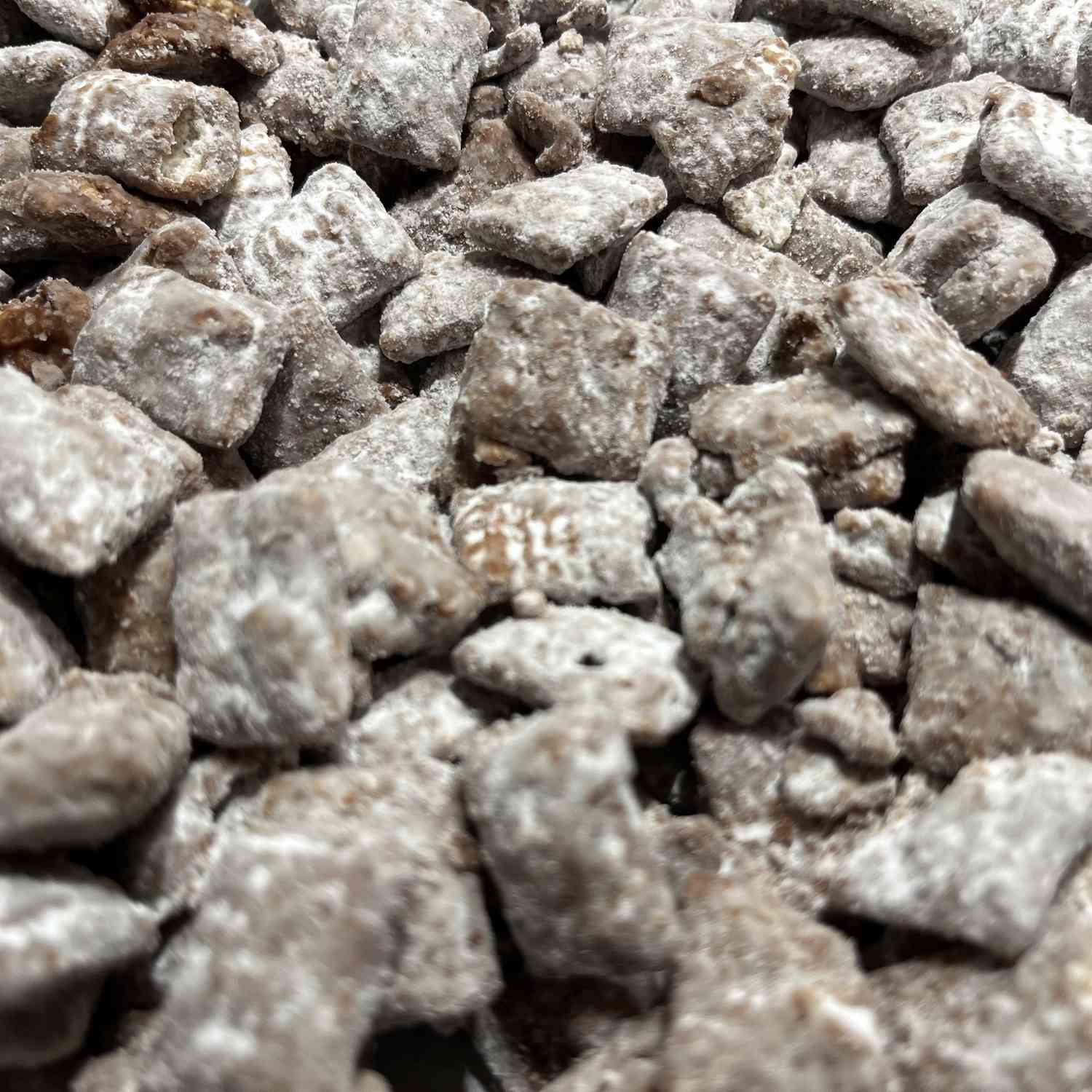 Close up of chocolate and powdered sugar-coated Chex cereal