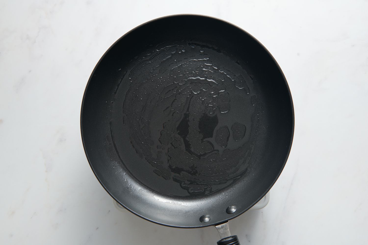 A large greased nonstick skillet